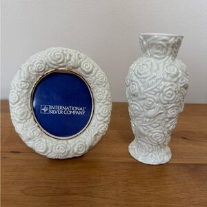 white porcelain rose-embossed bud vase and picture frame